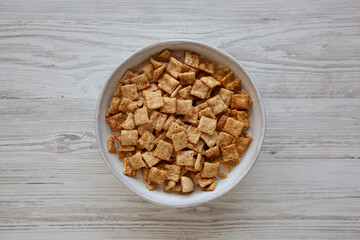 Crunchy Cinnamon Sugar Breakfast Cereal with Milk in a Bowl, top view.