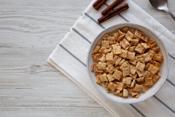 Crunchy Cinnamon Sugar Breakfast Cereal with Milk in a Bowl, top view. Copy space.
