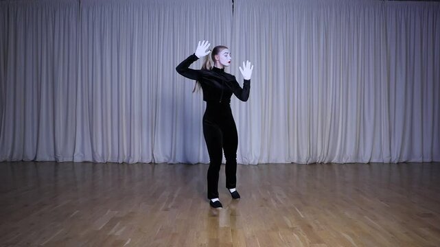 A mime girl walks through an imaginary door, a scene with a gradient of iridescent colors.