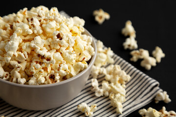 Homemade Butter Popcorn with Salt in a Bowl, side view.