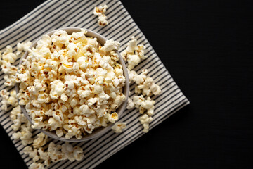 Homemade Butter Popcorn with Salt in a Bowl, top view. Copy space.