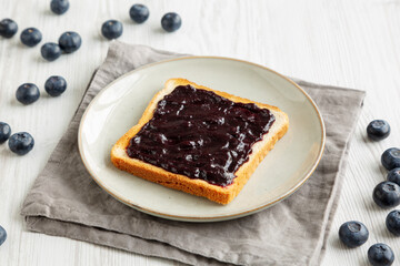 Healthy Blueberry Jelly and Toast on a Plate, side view.