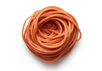 A bird's-eye view of a single portion of uncooked red pasta, neatly nested in a circle on a white background.