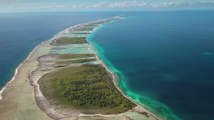 Stunning beauty of Tikehau atoll motu tropical island from above, aerial view vibrant lagoon, lush...