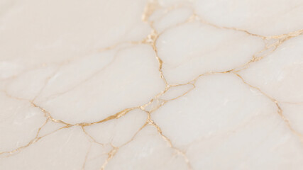 Elegant close up view of a luxurious light off white surface with gold veins