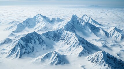 Obraz premium Snow Capped Mountain Range Above the Clouds Aerial Winter Landscape