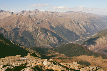 Dombay. Mountain landscapes against the background of a clear sky on a film camera. Tourism and...