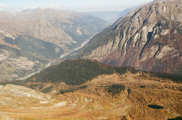 Dombay. Mountain landscapes against the background of a clear sky on a film camera. Tourism and...