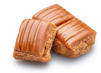 Caramel sweets or butterscotch fudge on white background. File contains clipping path.