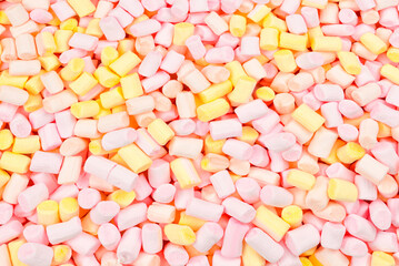 Marshmallow. Background of pink and yellow colorful mini marshmallows.