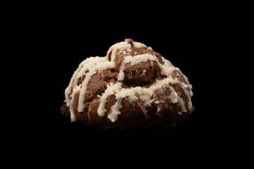 Profiteroles with coconut cream on a black background.