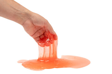 Red slime toy in man hand isolated on white.