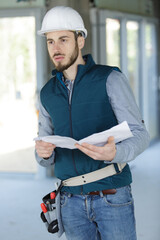 builder man checks plans project