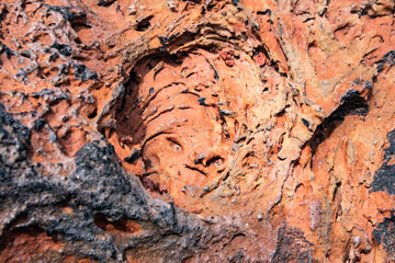 Unique geological formation with vibrant colors and intricate textures in a rocky landscape