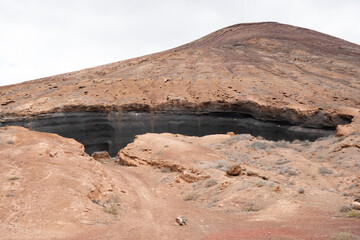 Exploring the unique geological formations at Montaña Maneje in Lanzarote's volcanic landscape