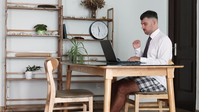 Online conference in a shirt and shorts.