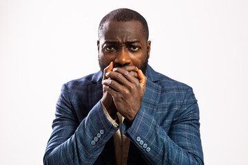 Portrait of tired and exhausted businessman. Black man in business suit is overworked and can't take stress anymore.