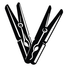 A Pair of Black and White Clothespins Crossed Over Each Other