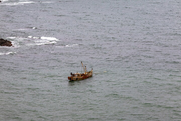 View from Cape Ostry on Sakhalin. A barge at anchor. The coast of the Sea of ​​Okhotsk. Sakhalin, Russia