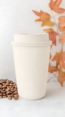 Cream Speckled Coffee Cup Mockup with Coffee Beans and Autumn Leaves