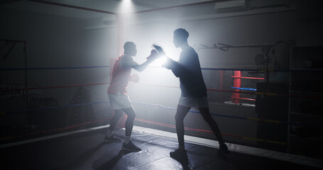 Boxing, team and workout with men in ring for sparring practice, training or fitness coaching. MMA...