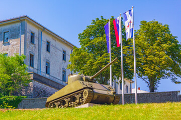 Tank and flags Postojna Pivka Park of Military History Slovenia.