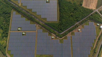 An aerial view of a solar power plant, also known as a solar park, is a large-scale photovoltaic...
