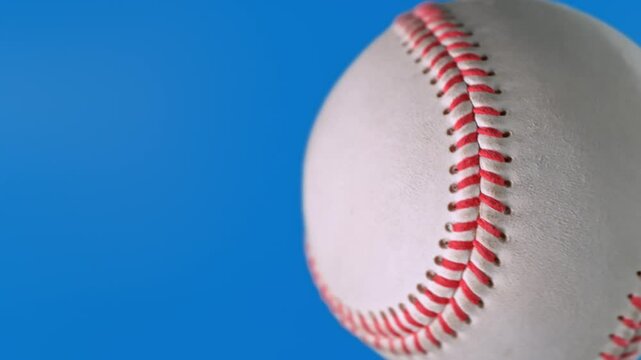 Super Slow Motion of Baseball Ball Hitting Camera on Blue Screen for Video Transition, 1000 fps.