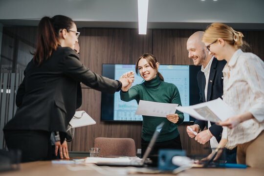 Professional team discussion promoting collaboration and goal alignment, with enthusiastic gestures and teamwork