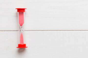 hourglass on the table, sand clock as time passing concept for business deadline, copy space