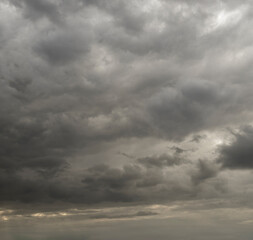 Dramatic Heavy Clouds Form a Captivating Sky, Hinting at Potential Rain in the Early Evening Twilight