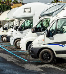campers and motorhomes on asphatl parning, white auto caravan for  vacation travel