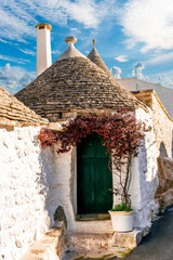 old mediterranean town with old beautiful houses with white walls and pretty tile roofs with ...