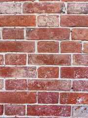 background of textured red brick wall with white cement joints