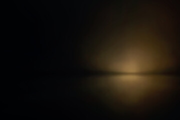 Soft golden haze in dark cinematic studio light