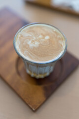 Layered dirty coffee in glass. Espresso shot poured over cold milk