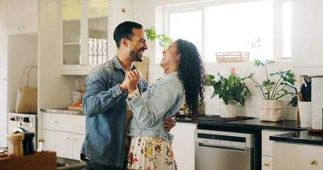 People, couple and laugh with dancing in kitchen for anniversary celebration, bonding and fun. Man, woman and relationship with smile as newlyweds at home for care, support and trust with music