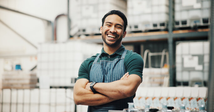 Distillery, happy and portrait of man with crossed arms for alcohol production, manufacturing and distribution. Warehouse, brewery business and confident person for fermentation, aging and drinks