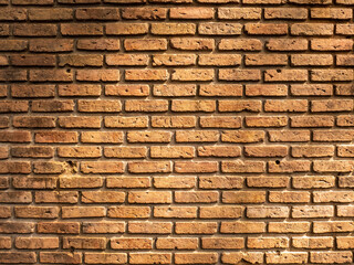 old red brick wall texture background crack on surface with light and shadow