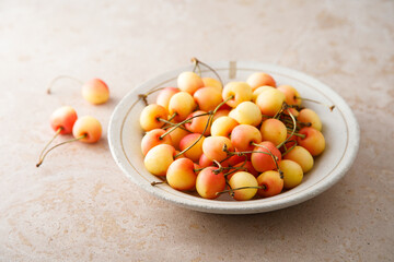 Pink cherry in a bowl