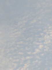 Blue Skies with wispy lines and fluffy white clouds