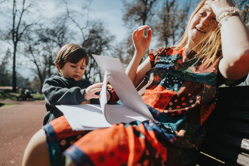 A cheerful moment between a mother and her child while interacting and enjoying the outdoors on a...