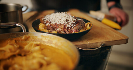 Cooking, food and steak plate in kitchen for dinner recipe, meal presentation and gourmet cuisine. Closeup, person or lunch preparation with healthy ingredients, catering service or protein nutrition