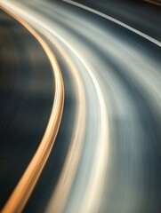 Abstract motion blur of road curves and lines in shades of gray and gold artistic style