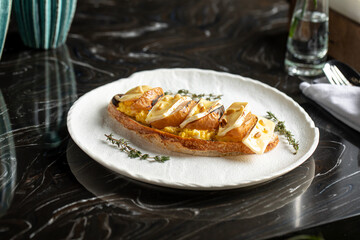 Toast with scrambled egg pear and brie cheese