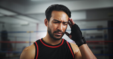 Man, headache and tired at gym for boxing, fatigue and concussion at training center. Person,...