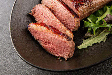 Duck breast roast meat poultry fresh delicious gourmet food background on the table rustic food top view copy space