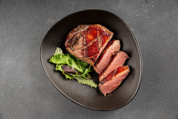 Duck breast roast meat poultry fresh delicious gourmet food background on the table rustic food top view copy space