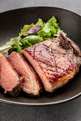 Duck breast roast meat poultry fresh delicious gourmet food background on the table rustic food top view copy space