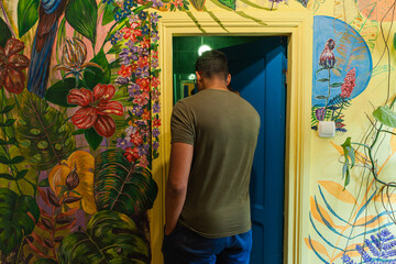 Colourful art hostel in old town with budget-friendly dorms, painted walls, shared kitchen, urban...